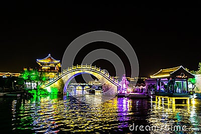 Qingming riverside in Kaifeng, known as â€œShui Xiâ€, is beautifully lighted a night. Stock Photo